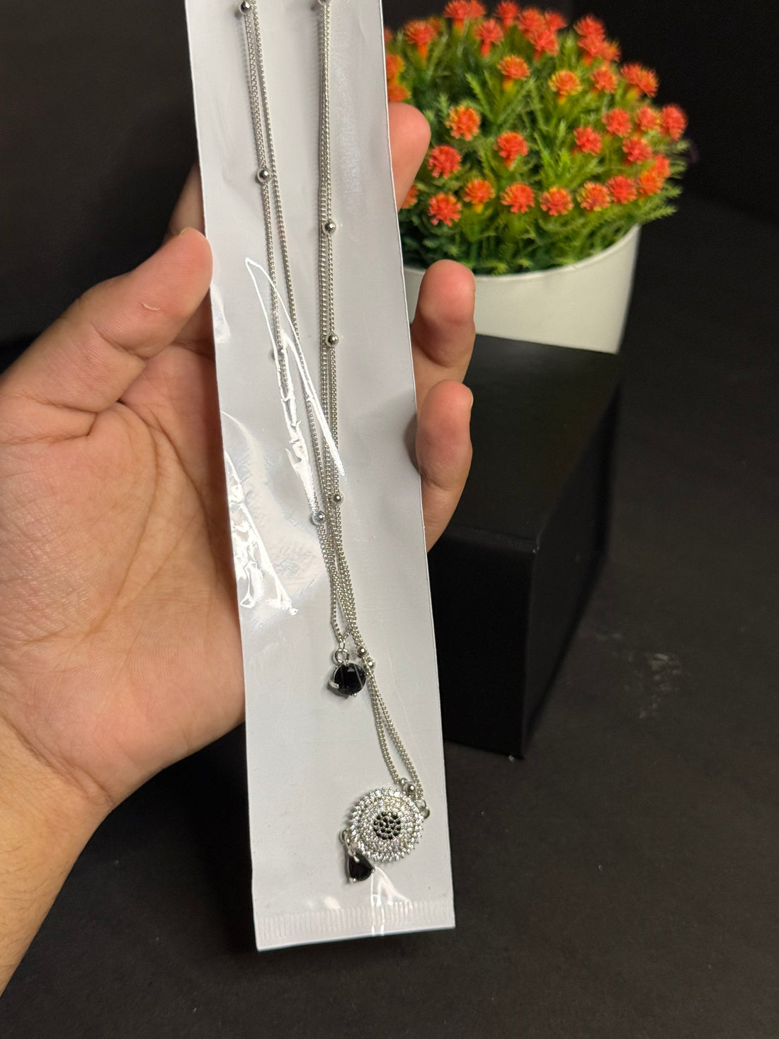 silver-colored fashion necklace